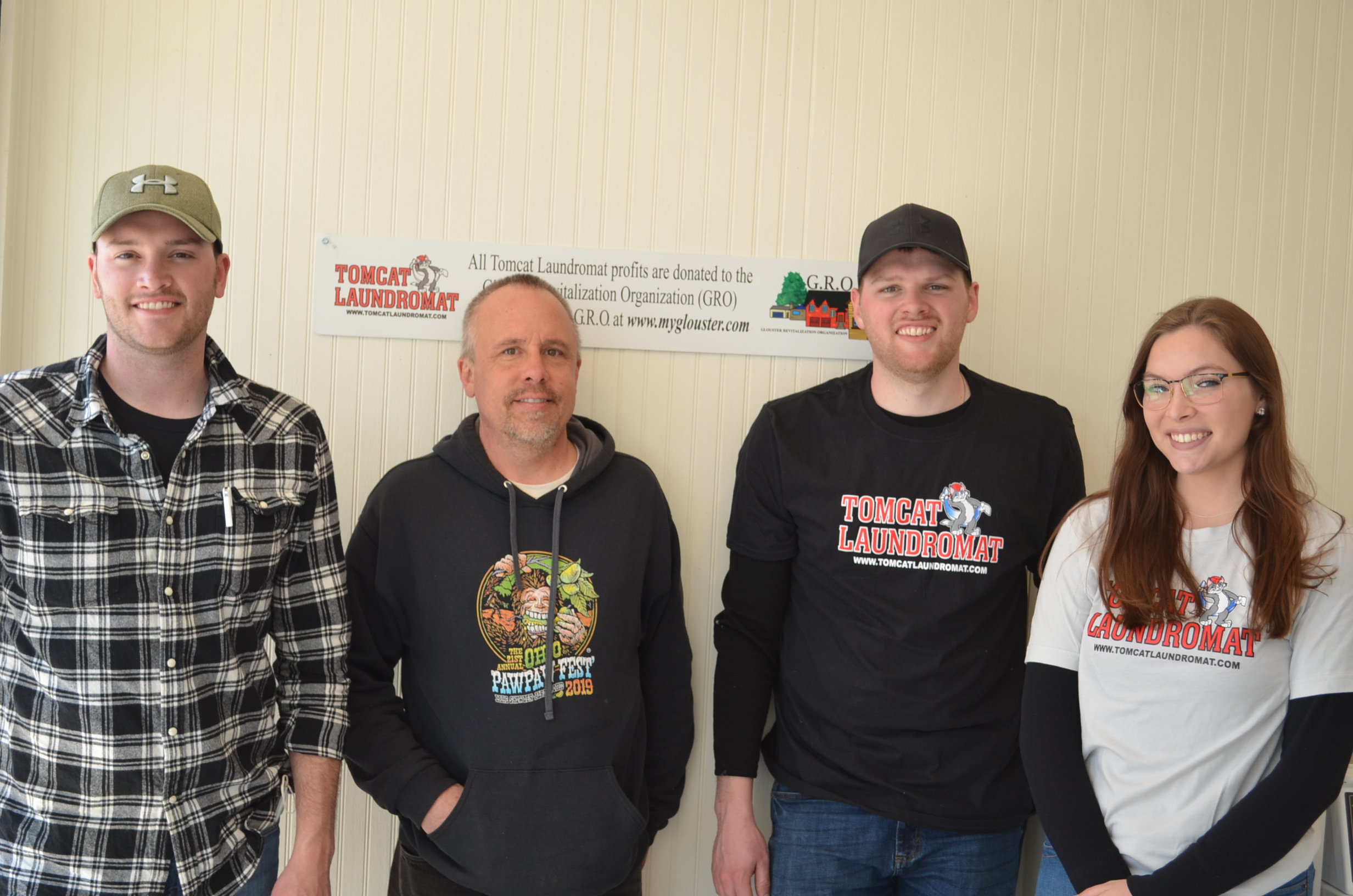 David Niese, Athens County Commissioner Chris Chmiel, Matthew Niese, and Tomcat Laundromat fan Tiffany